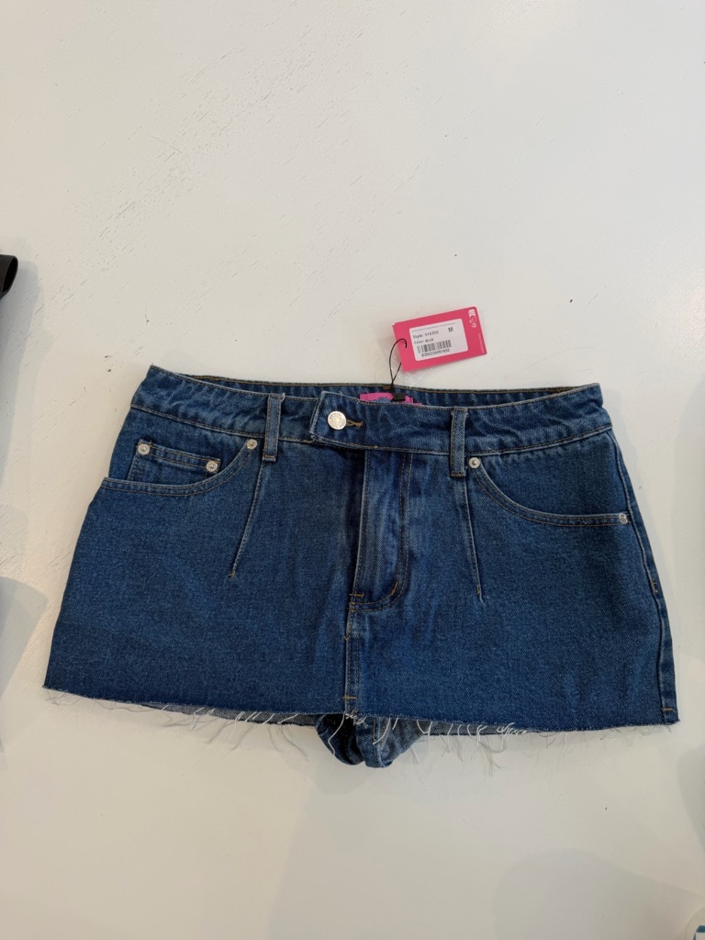 Edikted Blue Denim Mini Skirt with Button Accent